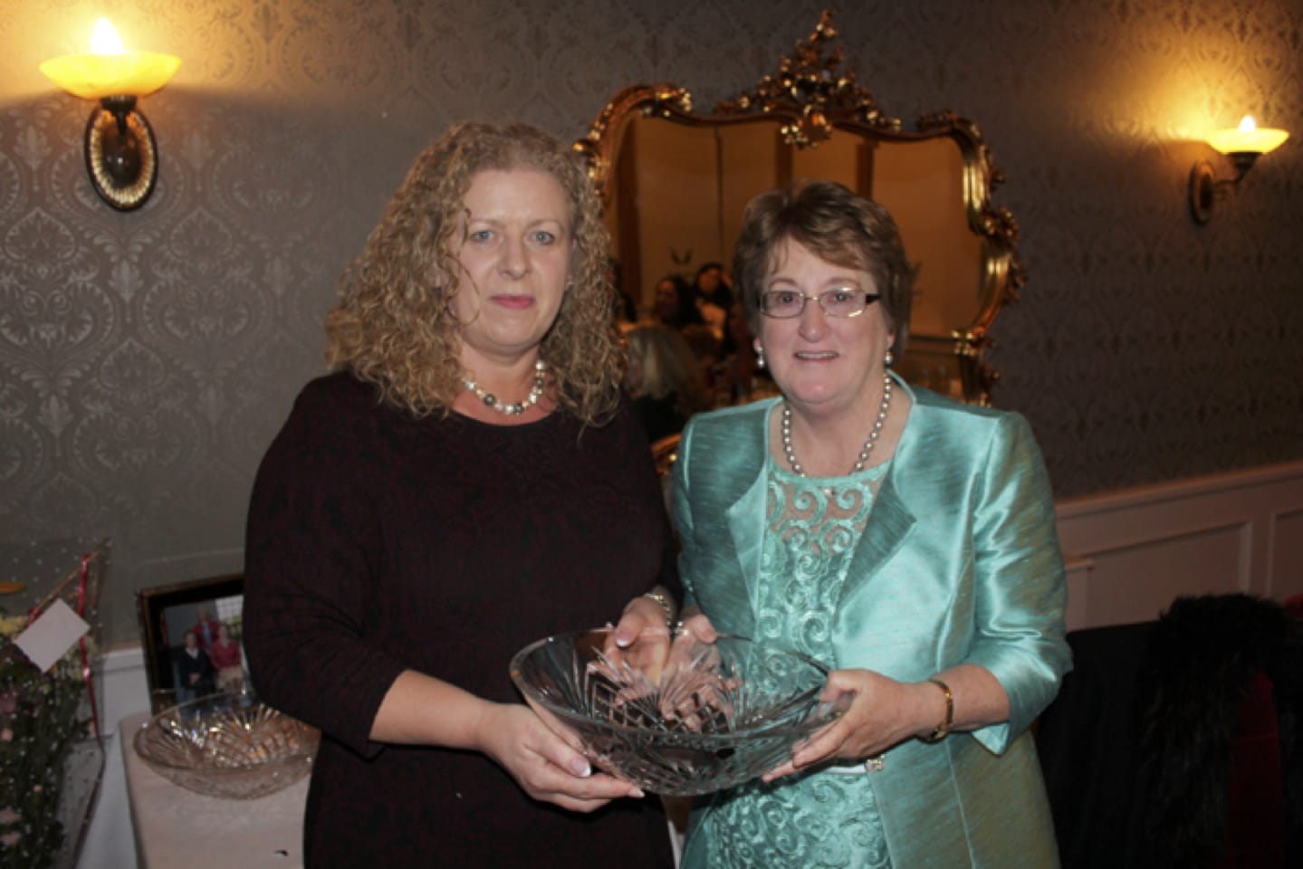 Feb 2017: Bernie Flynn being presented with some Waterford Crystal from Principal Vourneen Gavin Barry at her Retirement Party in the Devon Inn