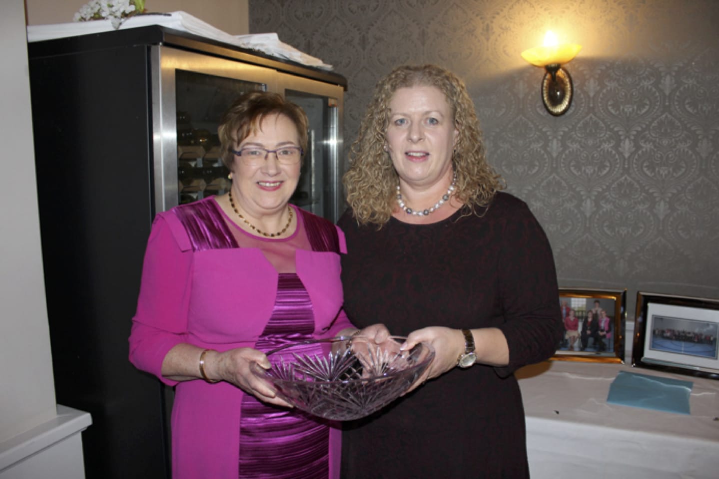 Feb 2017: Carmel Harnett being presented with some Waterford Crystal from Vourneen Gavin Barry at her Retirement Party in the Devon Inn